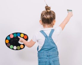 little-girl-painting-white-wall-with-brush-e1673508926337.jpg
